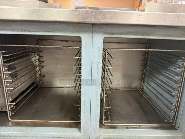 Delfield 3-door pizza prep table, 115v, excellent condition, stainless steel, spacious interior with shelving.