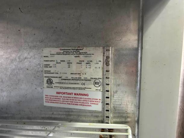 Continental UC27 7.4 Cu Ft undercounter refrigerator, excellent condition, visible label with model and electrical details.