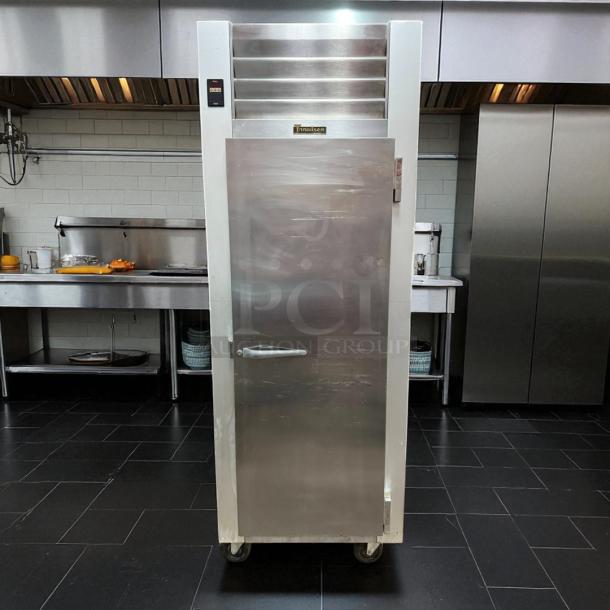Traulsen G12010 commercial freezer in excellent condition, fully tested and working, stainless steel, with temperature display.
