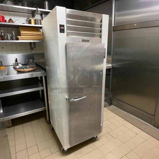 Traulsen Commercial Freezer, Model G12010, excellent condition, stainless steel, fully tested, with visible brand logo.