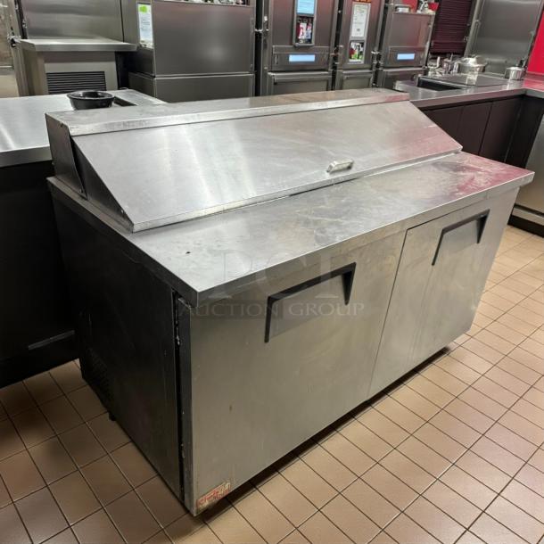 True TSSU-60-16 stainless steel refrigerated prep table with two solid doors, tested and working, in good condition.