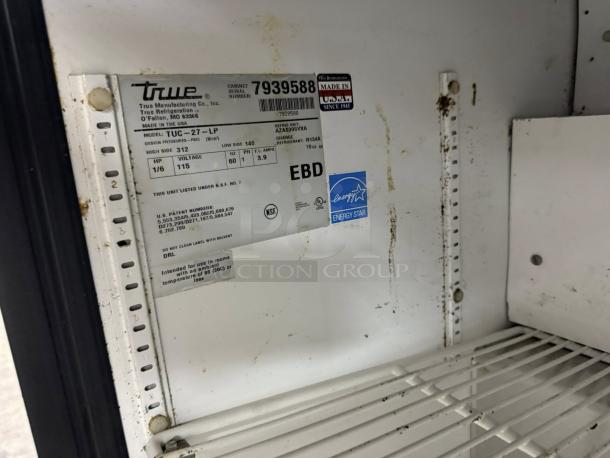 True TUC-27-LP-HC undercounter fridge, excellent condition. Interior label: model details, voltage, and Energy Star-rated.