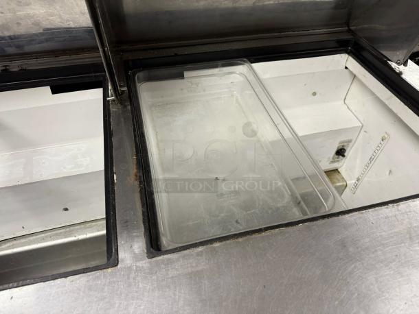 True TSSU-60-16-HC 60in Stainless Sandwich Salad Prep Cooler. Interior detail. Good condition, tested and working.