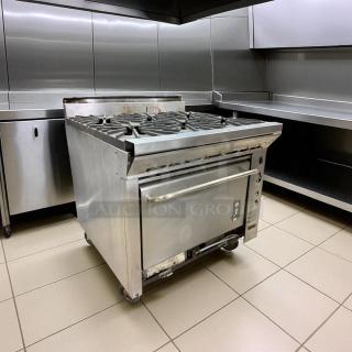 Montague 6-burner gas range with oven, excellent condition, natural gas, fully tested and working, stainless steel finish.