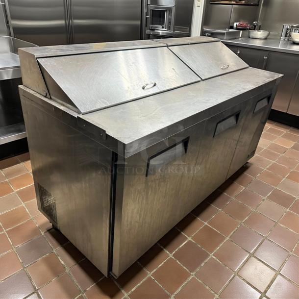 Titan XTSU72 72" 3-door sandwich prep table in great condition, 115v, 1ph. Stainless steel with lid handles, tested and working.