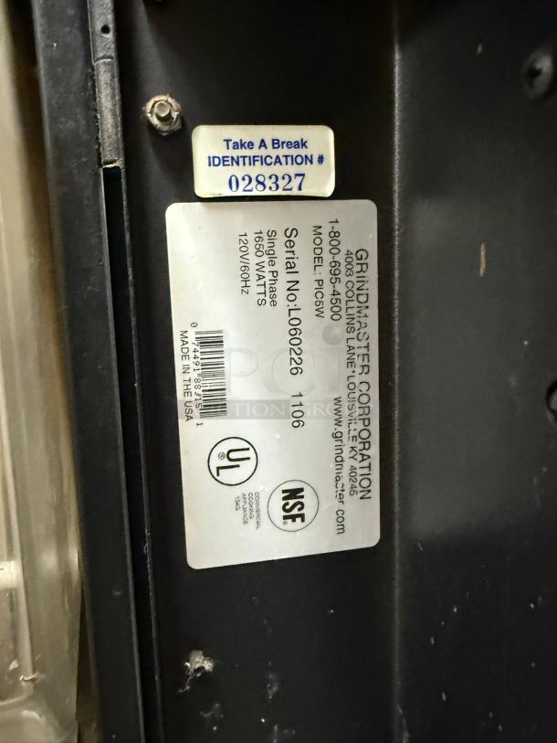 Grindmaster PIC5 dispenser label showing model info, serial number L060226, 120V/1650W, UL and NSF certifications, and identification sticker.