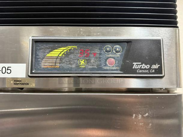 Turbo Air TSR-49SD-N6 refrigerator display showing temperature at 39°F, with control panel and branding visible.