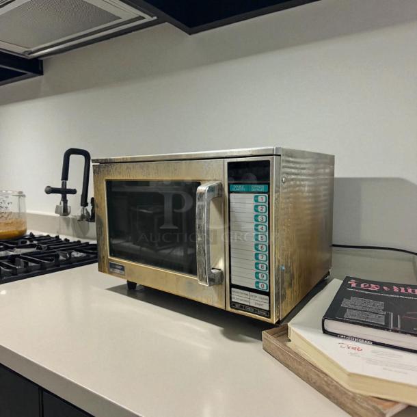 Sharp R-22GTF heavy-duty commercial microwave oven, 1200W, 120V, tested and working, with numeric keypad, in good condition.