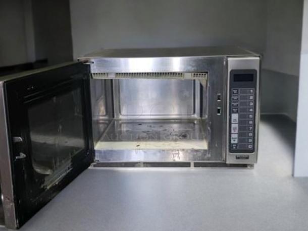 Amana RFS12MP-SA commercial microwave oven in excellent condition, stainless steel, with open door, visible control panel, fully tested.