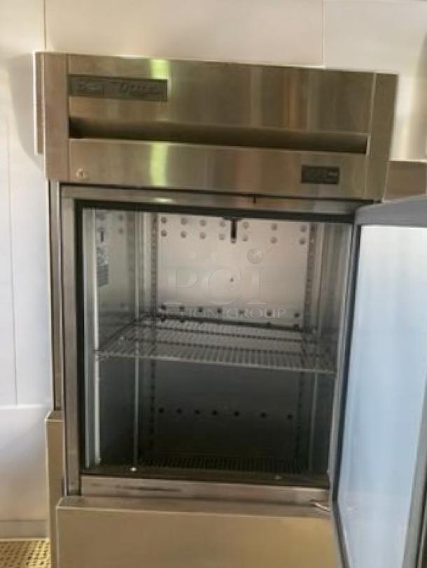 True T-23F-HC reach-in freezer, single section, half doors, stainless steel, excellent condition, 115V, fully tested.
