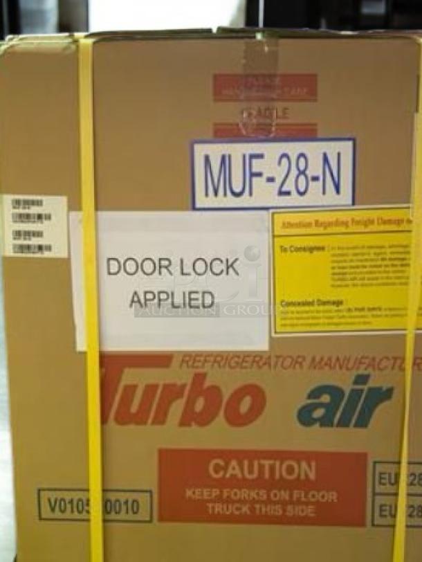 Brand new Turbo Air MUF-28-N undercounter freezer in packaging. Model labels, caution signs, and shipping info visible.
