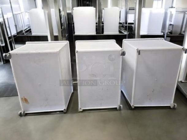 Three Commercial Kitchen Grade ingredient storage bins on casters with hinged lids in great condition.
