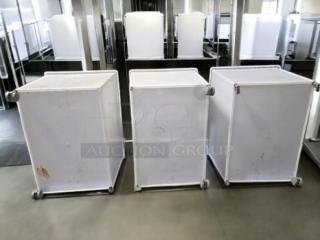 Three Commercial Kitchen Grade ingredient storage bins on casters with hinged lids in great condition.