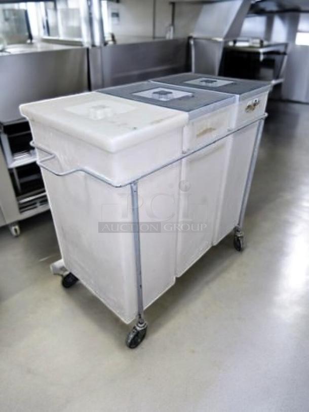 Faribo 3-Bin Cart with stainless steel frame, sliding covers, and casters. Good condition, fully tested, mobile storage system.