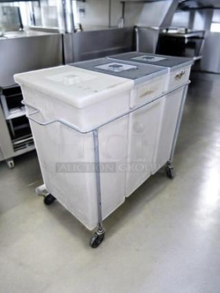 Faribo 3-Bin Cart with stainless steel frame, sliding covers, and casters. Good condition, fully tested, mobile storage system.