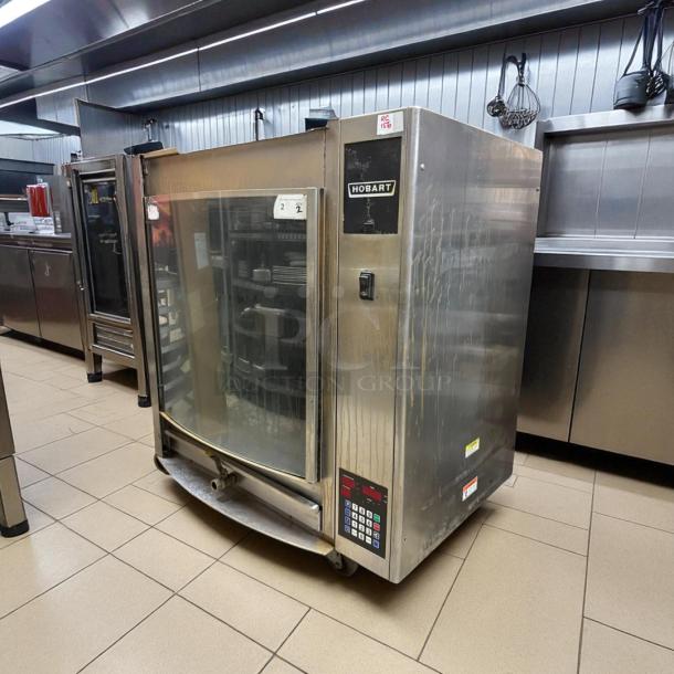 Hobart HR7P electric rotisserie oven in stainless steel, tested and working, visible control panel, glass front, good condition.