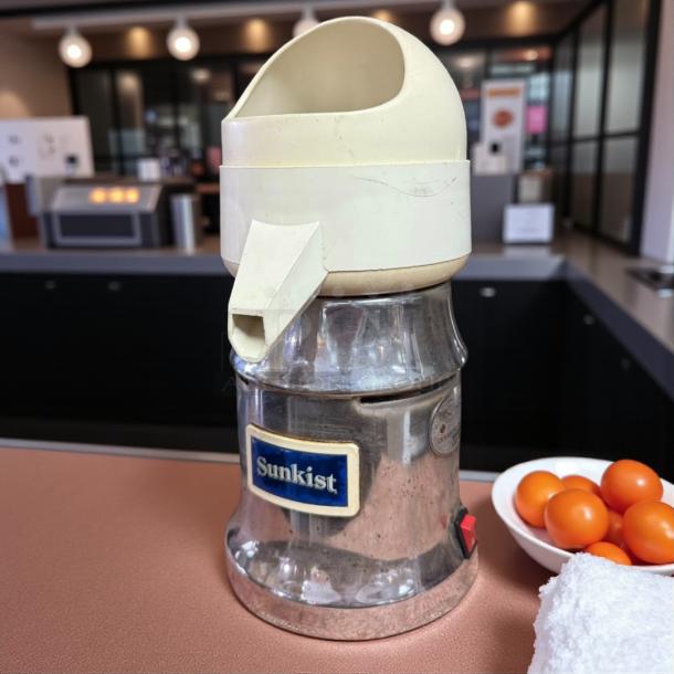 Sunkist J-1 Commercial Citrus Juicer, 115V, 3450 RPM, tested and working. Features chrome finish, visible brand label.