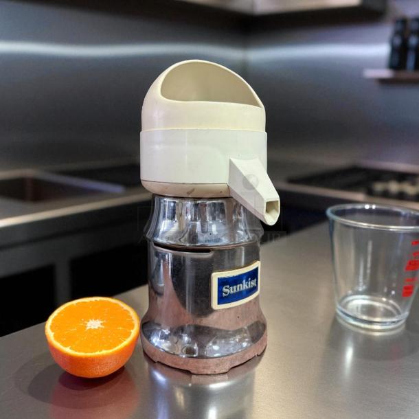 Sunkist J-1 Commercial Citrus Juicer, 115V, 3450 RPM, silver base, tested and working, includes blue logo plate.