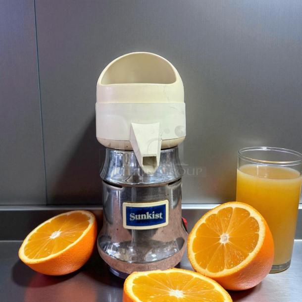 Sunkist J-1 Commercial Citrus Juicer, stainless steel, 115V, 3450 RPM, tested and working. Sunkist label visible.