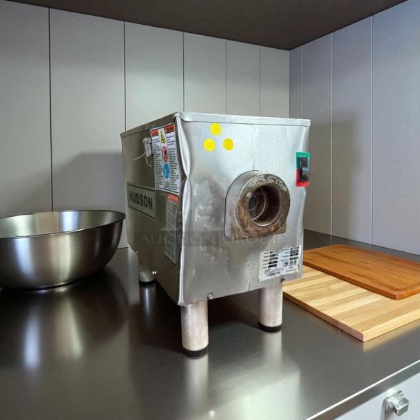 Hudson Procut KG-22-W electric meat grinder in great condition on countertop, missing front attachment, visible labels and switches.