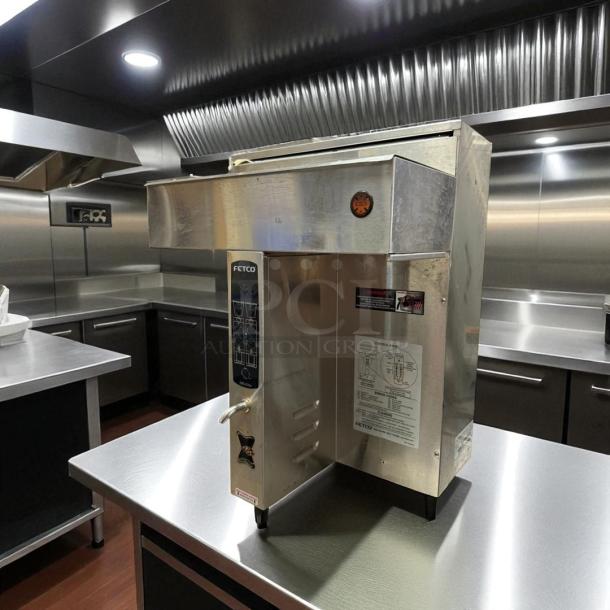 Fetco CBS-2032e Twin Coffee Brewer, excellent condition, 220–240V, fully tested, stainless steel finish, visible control panel.