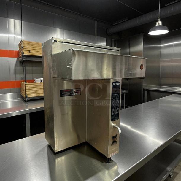 Fetco CBS-2032e Twin Coffee Brewer in excellent condition, 220-240V, fully tested and working, featuring stainless steel body.