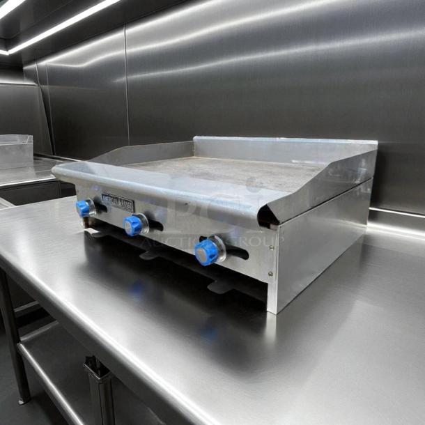 Imperial ITG-36 36" commercial gas griddle with thermostatic controls on stainless steel countertop; tested and working condition.