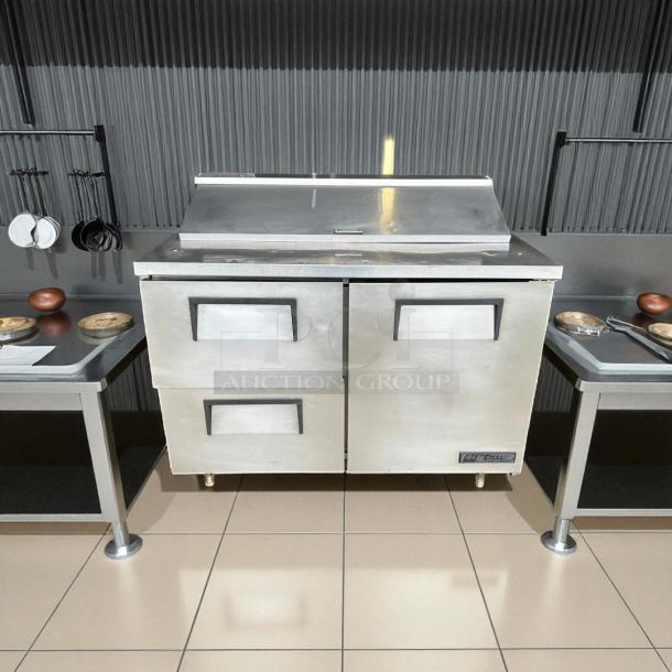 True TSSU-48-12D-2 sandwich prep table, 48", stainless steel, excellent condition, 115V, fully tested and working.