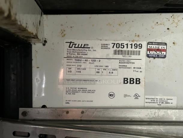 True TSSU-48-12D-2 sandwich/salad prep table label showing model, voltage (115V), and refrigerant details. Made in USA.