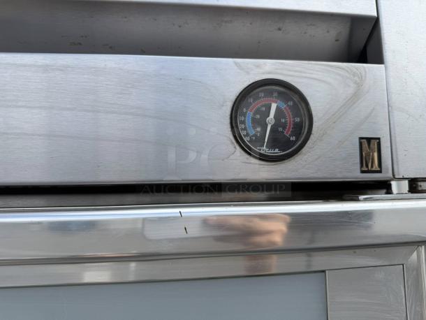 True T-19G-HC 27" glass door refrigerator, excellent condition, featuring a visible temperature gauge.