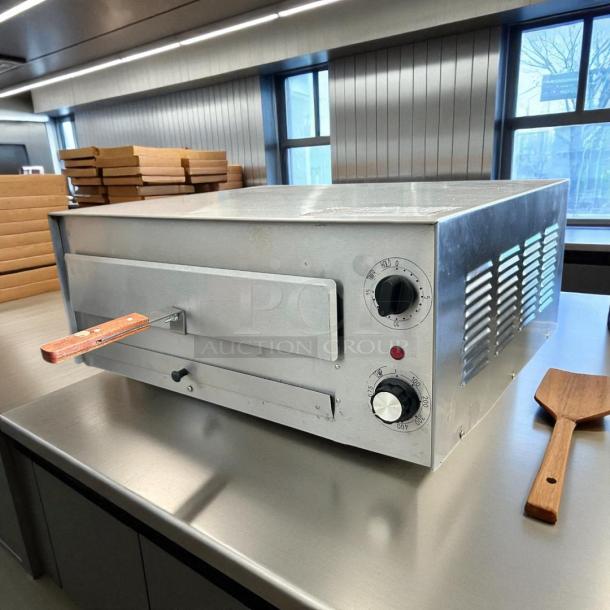 WISCO 560B Deluxe Pizza Oven, 120v, 1700 watts; tested, working condition; features temperature dial and timer.