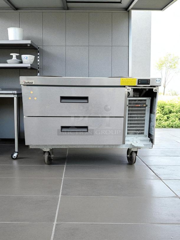 Randell 2-drawer refrigerated chef base on wheels, excellent condition, 115V, fully tested and working, with visible warning label.