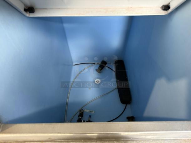 Hoshizaki KM-350MAJ ice machine bin interior, showing clean storage area with wiring and components, 300 lb capacity.