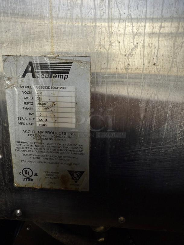 AccuTemp S62083D100 label, detailing model, voltage, and safety warnings on stainless steel surface.