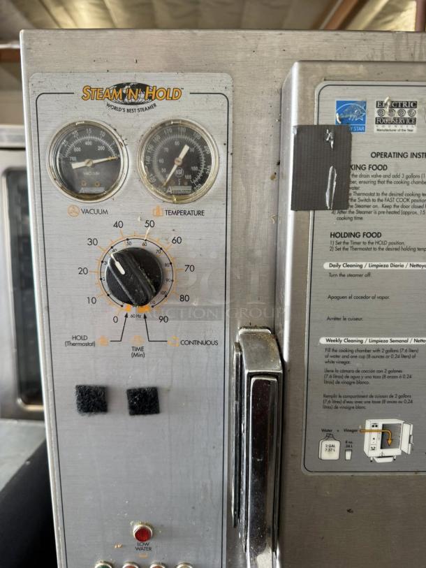 AccuTemp S62083D100 Steam'N'Hold control panel, showing vacuum and temperature gauges, dials, and indicator lights.