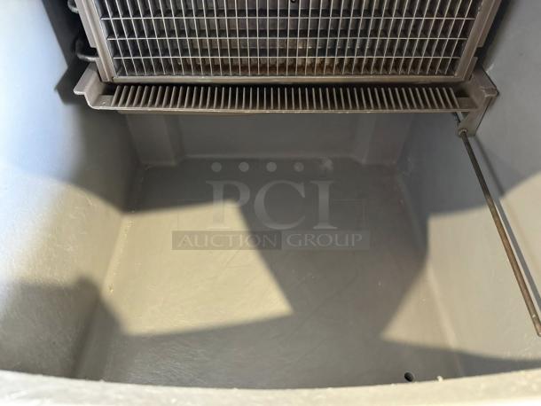Interior of True STA1R-2HS refrigerator showing clean, spacious compartment and functional cooling unit.