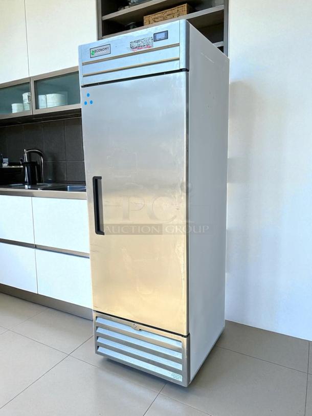 Economy EF1A-FS single door commercial freezer in excellent condition, fully tested, 115V, stainless steel, visible Economy logo.