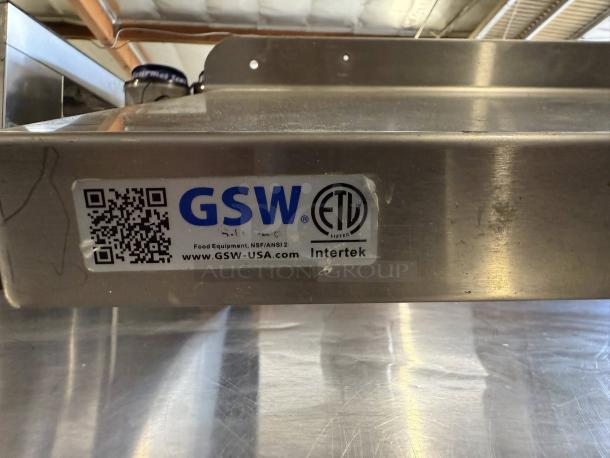GSW wall mount shelf, 48" x 13.5", excellent condition. Features NSF/ANSI certification label and QR code.