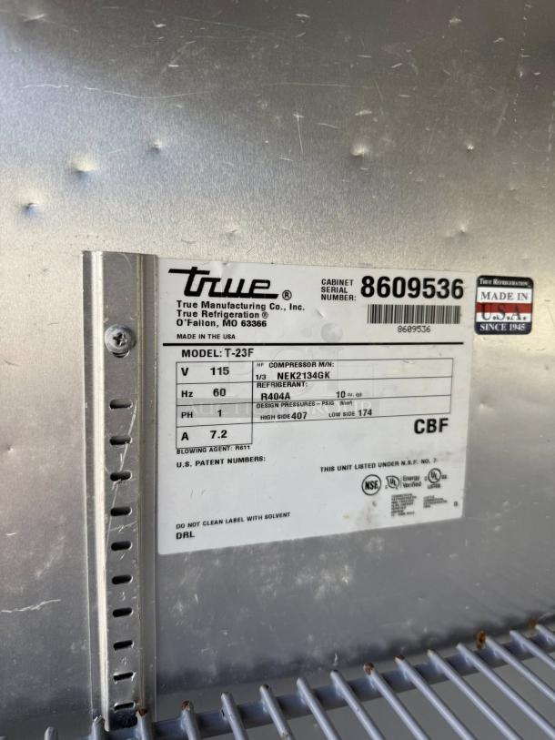 True T-23-HC refrigerator label showing model, serial number 8609536, and specifications. Made in USA.