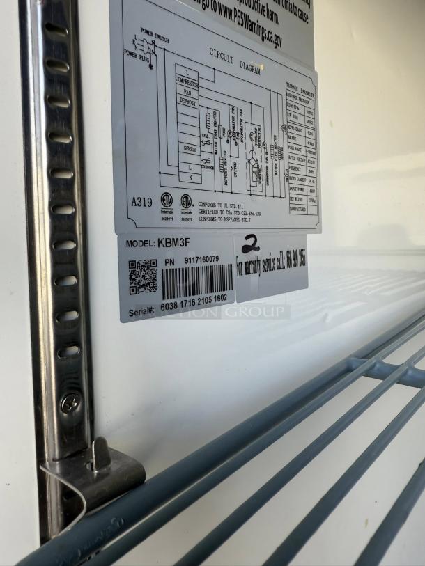 Kintera KBM3R circuit diagram and label on refrigerator interior, showing model and serial number details.