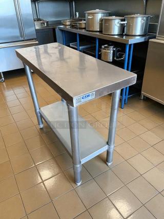 GSW 12x30 stainless steel stand table in great condition, features a lower shelf and sturdy legs, perfect for kitchen use.