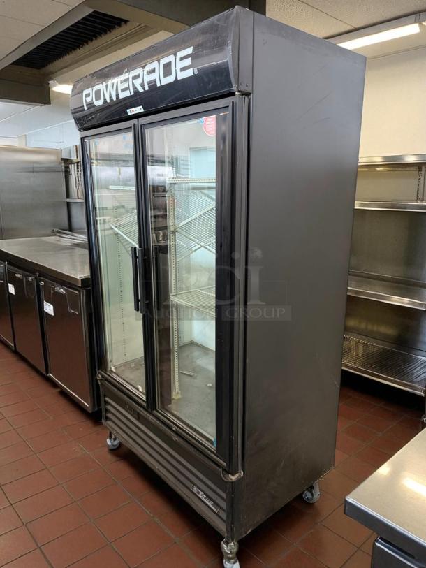 True GDM-43 glass door merchandiser, 47 1/8", white, tested and working, features left/right hinge doors, great condition.