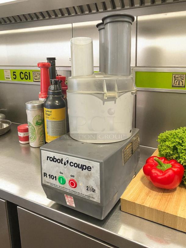 Robot Coupe R101 food processor in excellent condition. Features 2 Qt. clear bowl, vegetable prep lid, 5 discs, 3/4 hp.