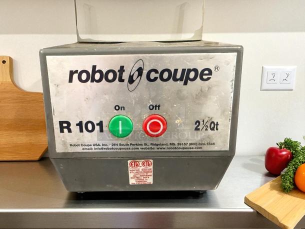Robot Coupe R101PPLUS food processor, excellent condition, 2 Qt. capacity, on/off buttons visible, model R101, tested working.
