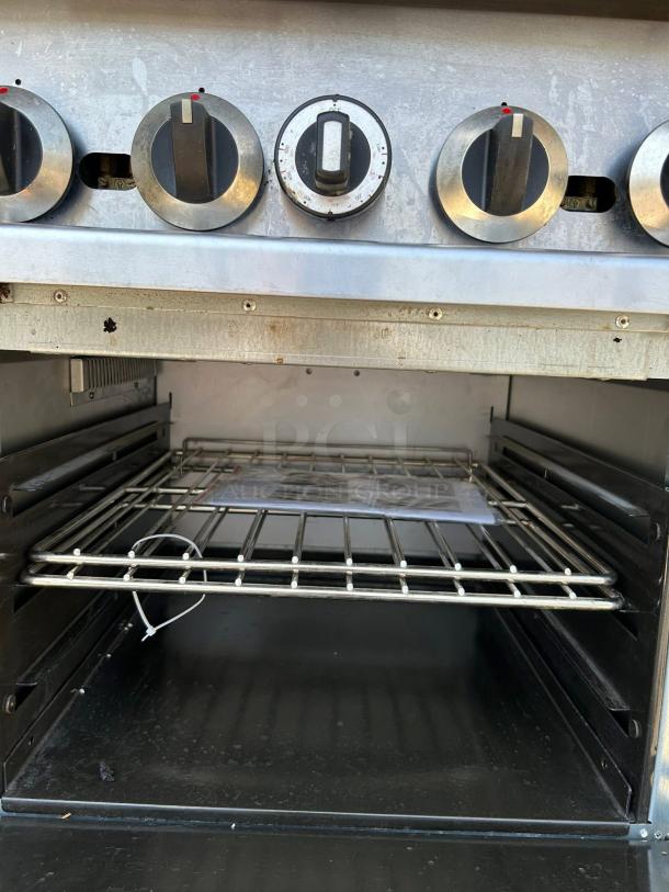 Cooler Depot TC-R24 4 Burner Commercial Oven Range, tested and working. Features dials, open oven with rack.