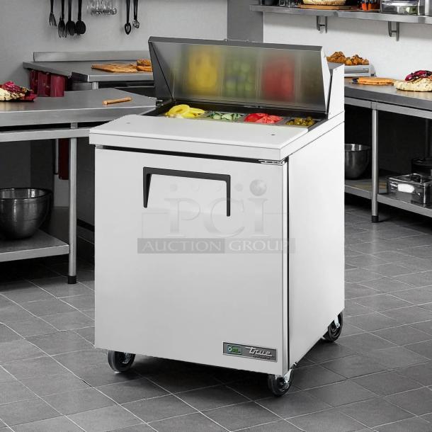True TSSU-27-08 refrigerated prep table, stainless steel, 27" wide, excellent condition, tested and working.