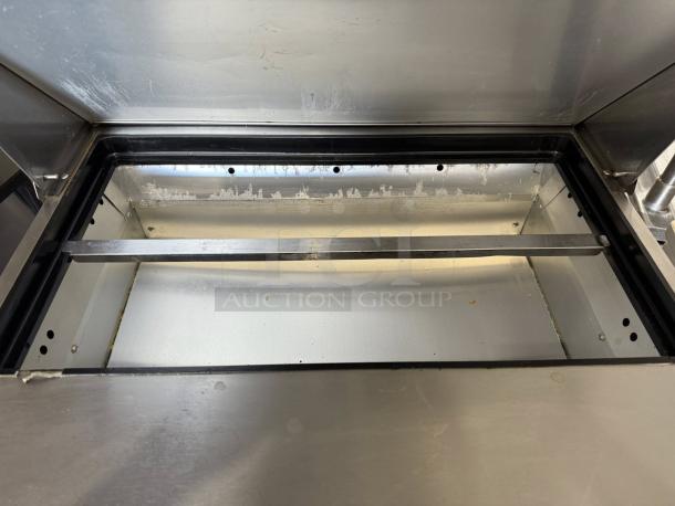 True TSSU-27-08 27" stainless steel refrigerated prep table interior, excellent condition, tested and working.