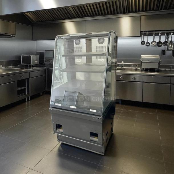 Structural Concepts dry display case in excellent condition, glass front, multiple shelves, tested and fully working.