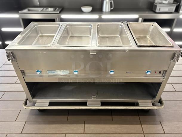 Duke E-4-DLSS 60" hot food table with 4 wells, cutting board, and thermostatic control. Tested, working condition.