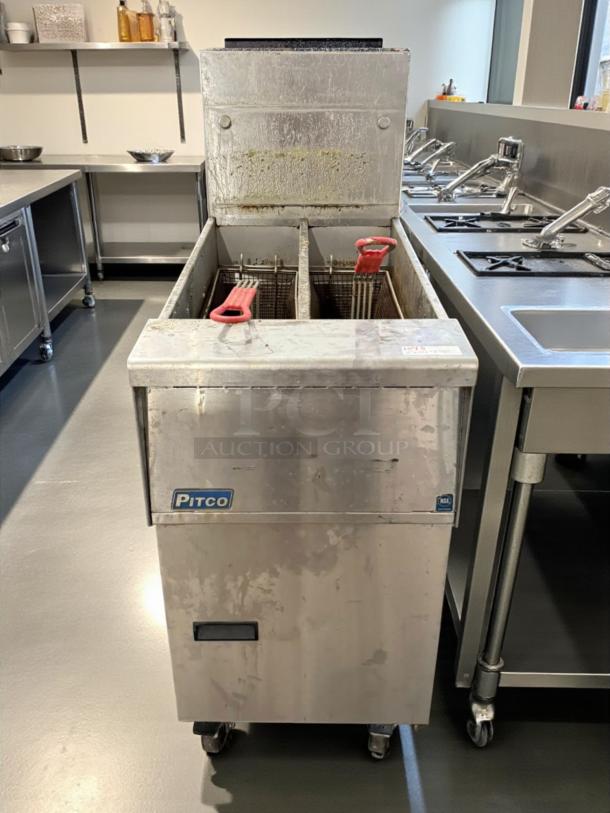 Pitco SG14TS split pot floor fryer, 20-25 lb. capacity, 100,000 BTU, natural gas, tested, working, visible wear.